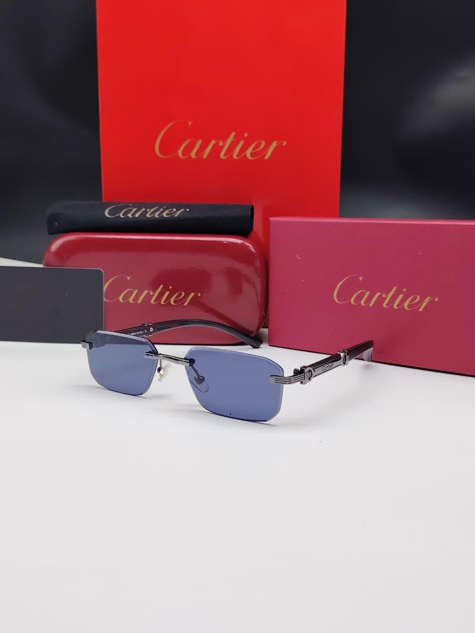 نظارات شمسية كارتييه رمادي داكن/فضي بدون إطار مستطيلة الشكل وعدسات كحلي/أزرق داكن Cartier Dark Silver Rimless Rectangular Navy Blue Sunglasses